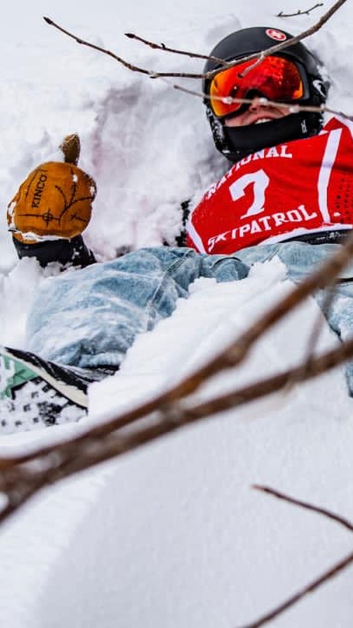 Lying in deep snow in Trashbags snow pants