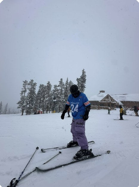 Bennett skiing in Trashbags snow pants